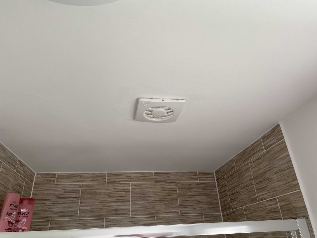 Extractor fan installed in a bathroom, essential for removing excess moisture and preventing black mould formation
